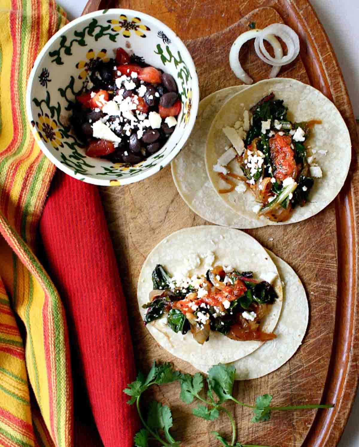 Swiss Chard tacos with caramelized onions.