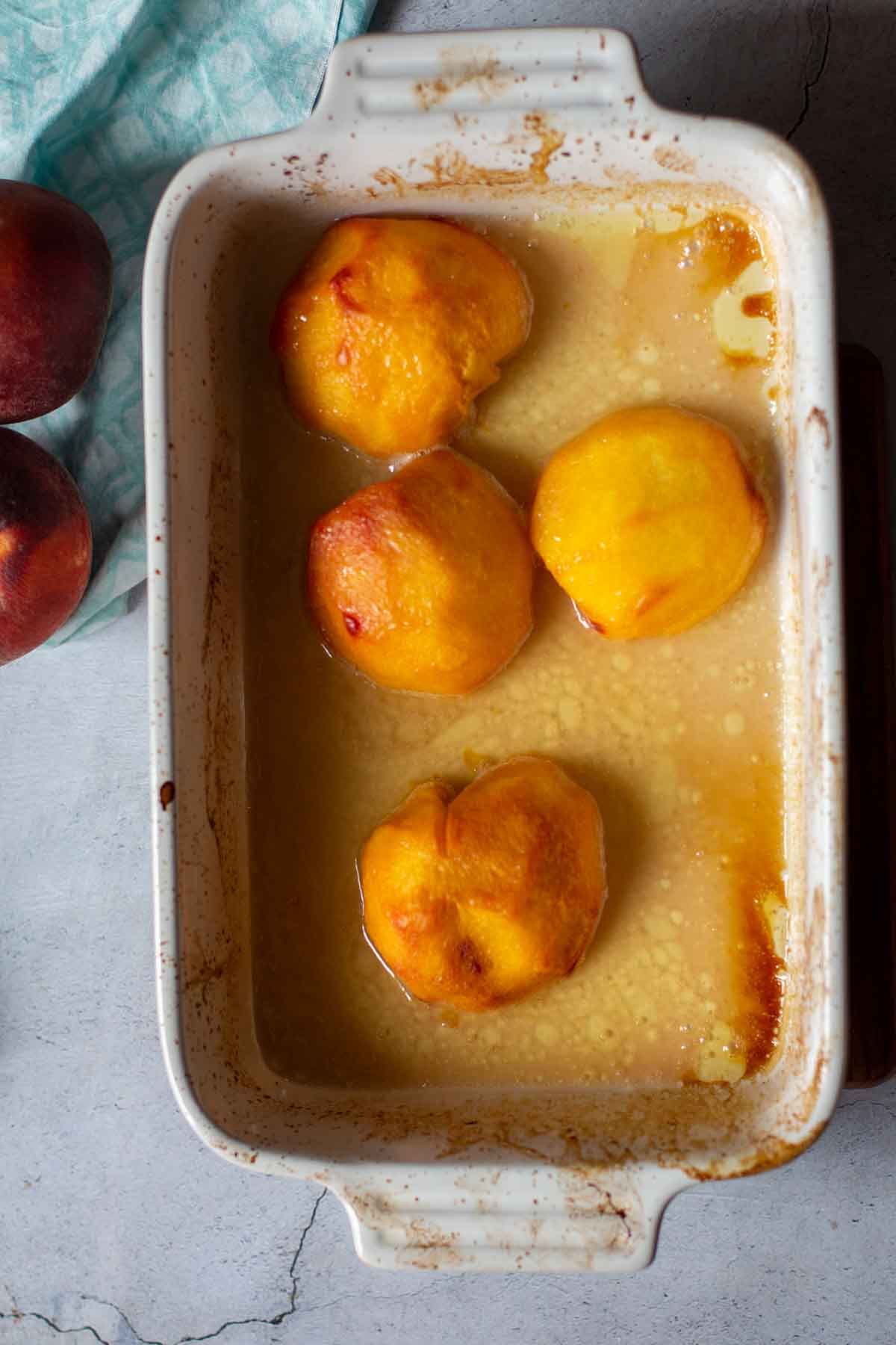 Baked roasted peaches in a vanilla butter sauce.