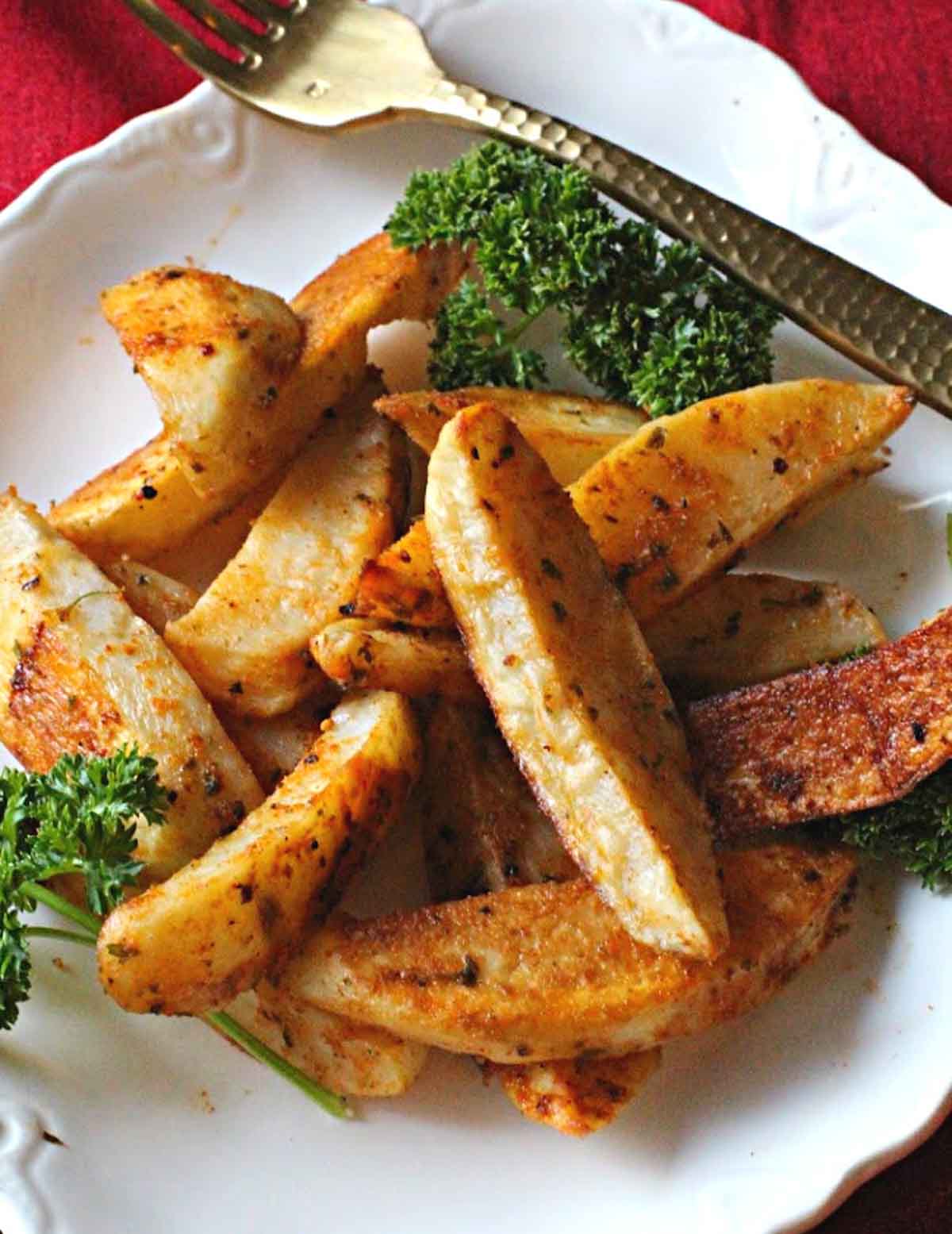 oven baked steak fries seasoned with paprika and garnished with parsley
