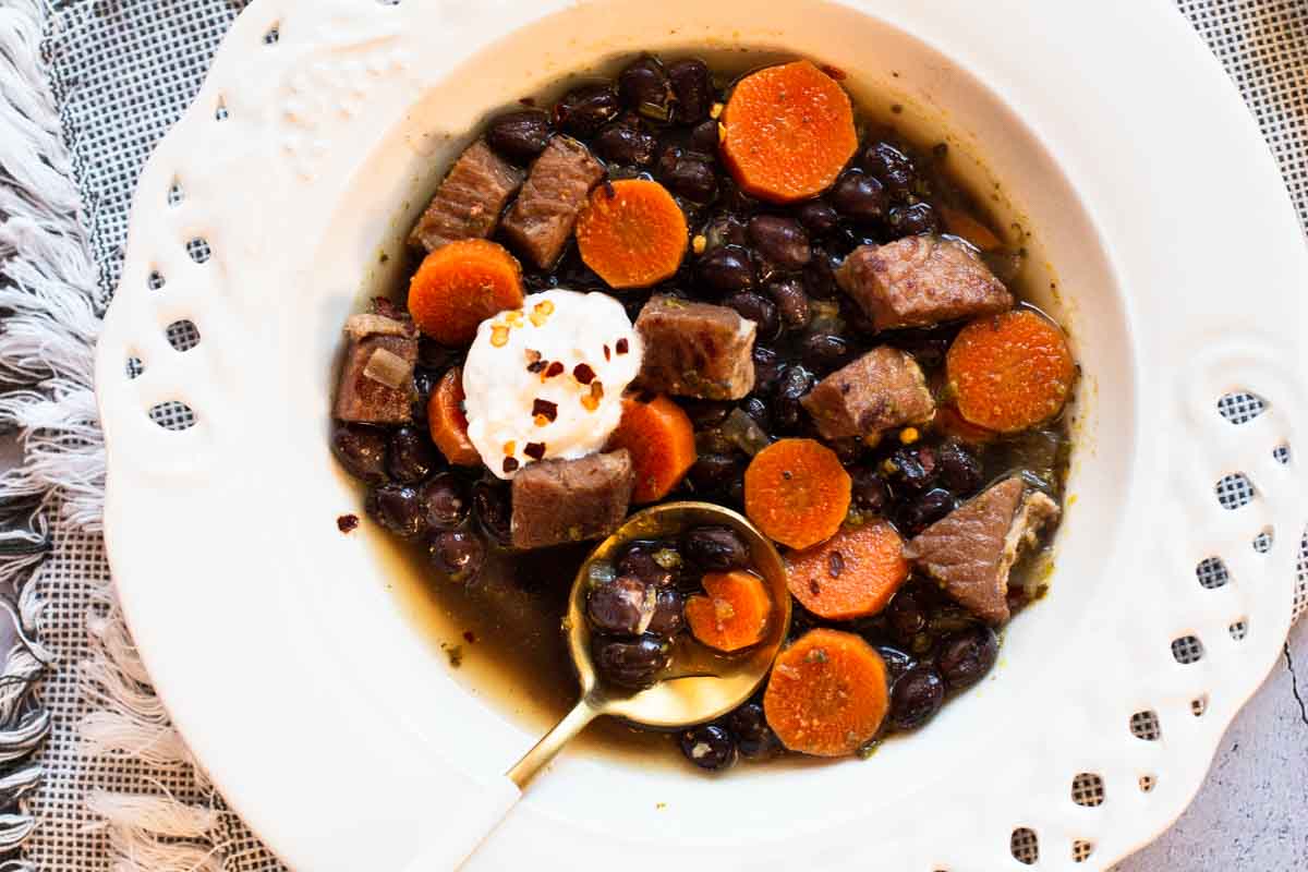 Black bean soup with ham and carrots.