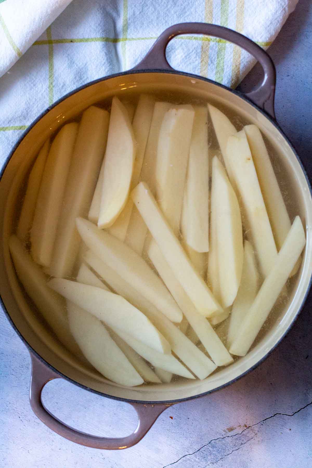 Parboiling potatoes for oven baked home fries.