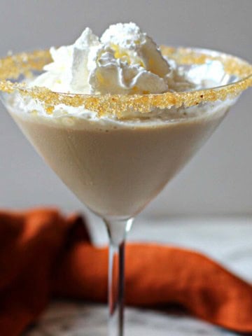 Pumpkin Martini recipe topped with whipped cream.