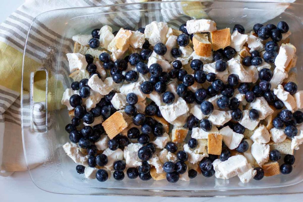 French bread and blueberries in a 9 x 13 casserole