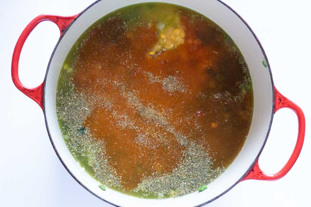 Adding spices to rotisserie chicken soup