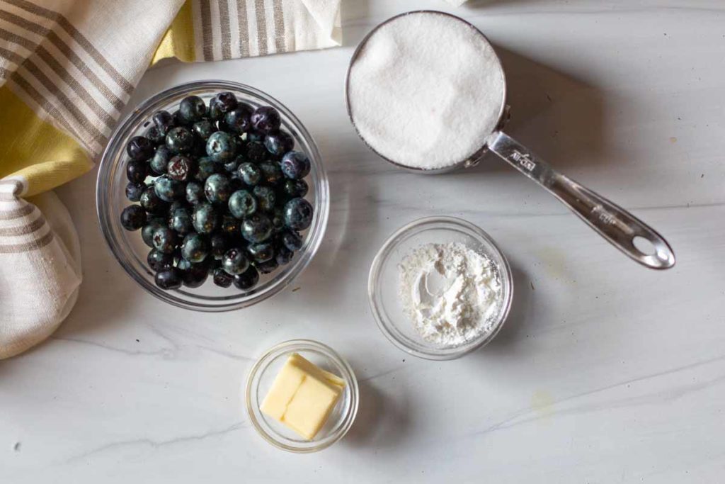 Ingredients to make homemade blueberry syrup.