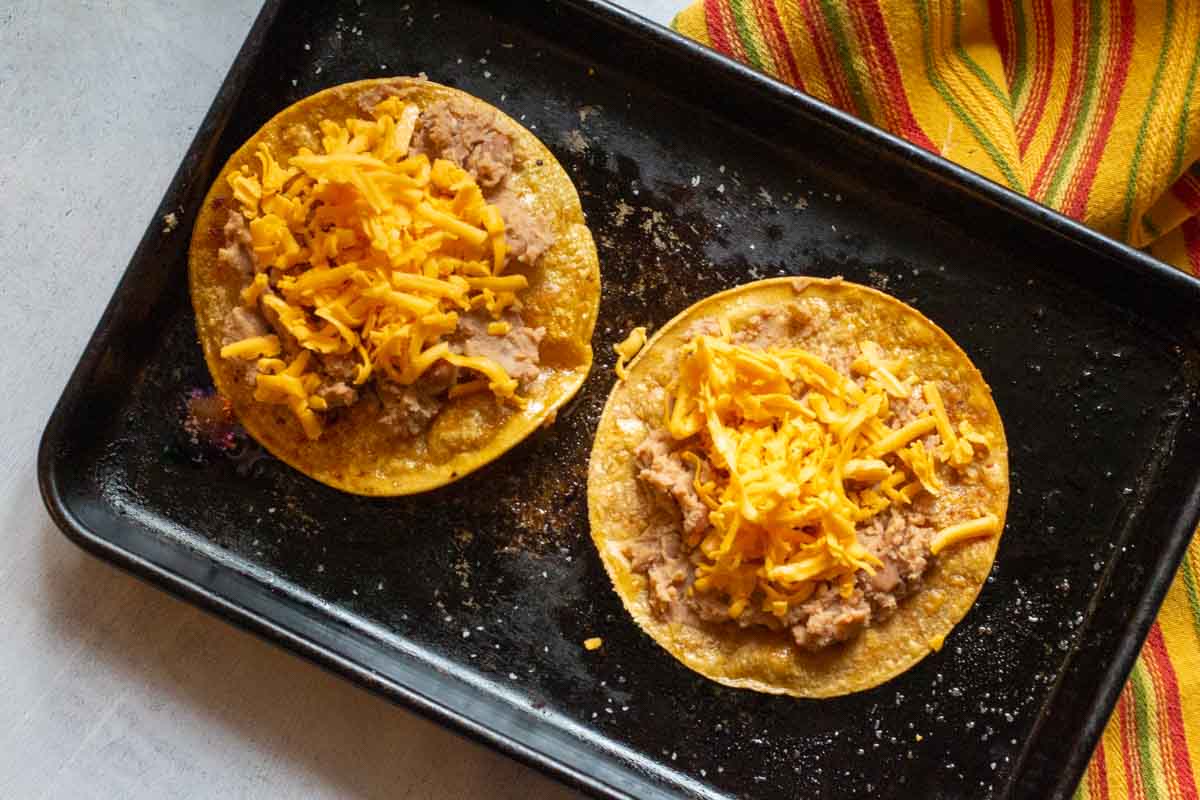 Homemade tostadas with refried beans and cheese.