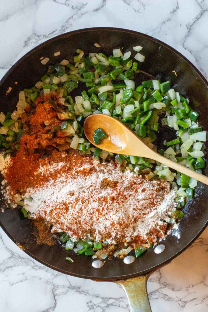 Adding flour and spices to thicken cheese chicken soup