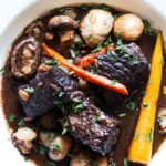 Red wine beef stew with carrots and mushrooms.