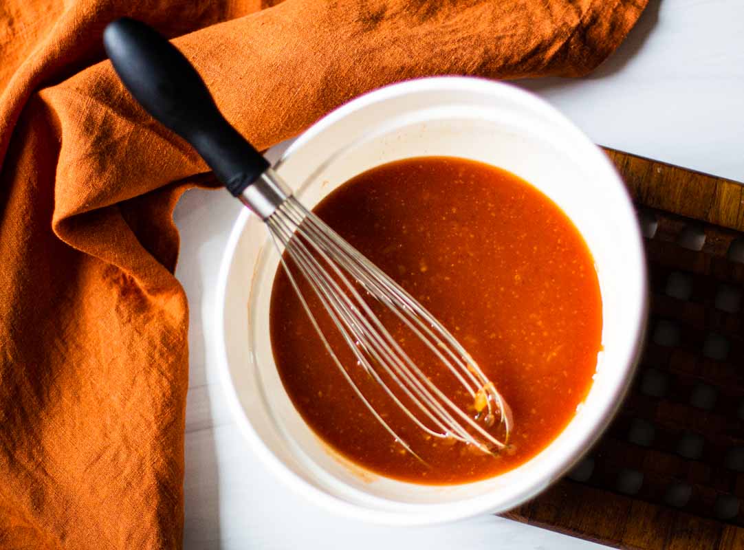 Mixing ingredients to make homemade catalina dressing.