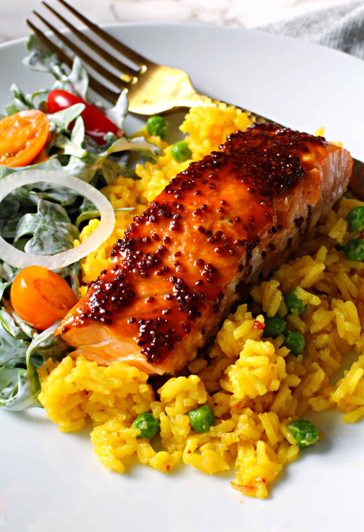 Salmon fillet glazed with maple syrup and dijon country mustard. Served over yellow rice and sided with a tossed salad with buttermilk ranch dressing