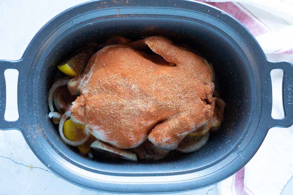 Rotisserie Chicken In the crock pot ready to cook.