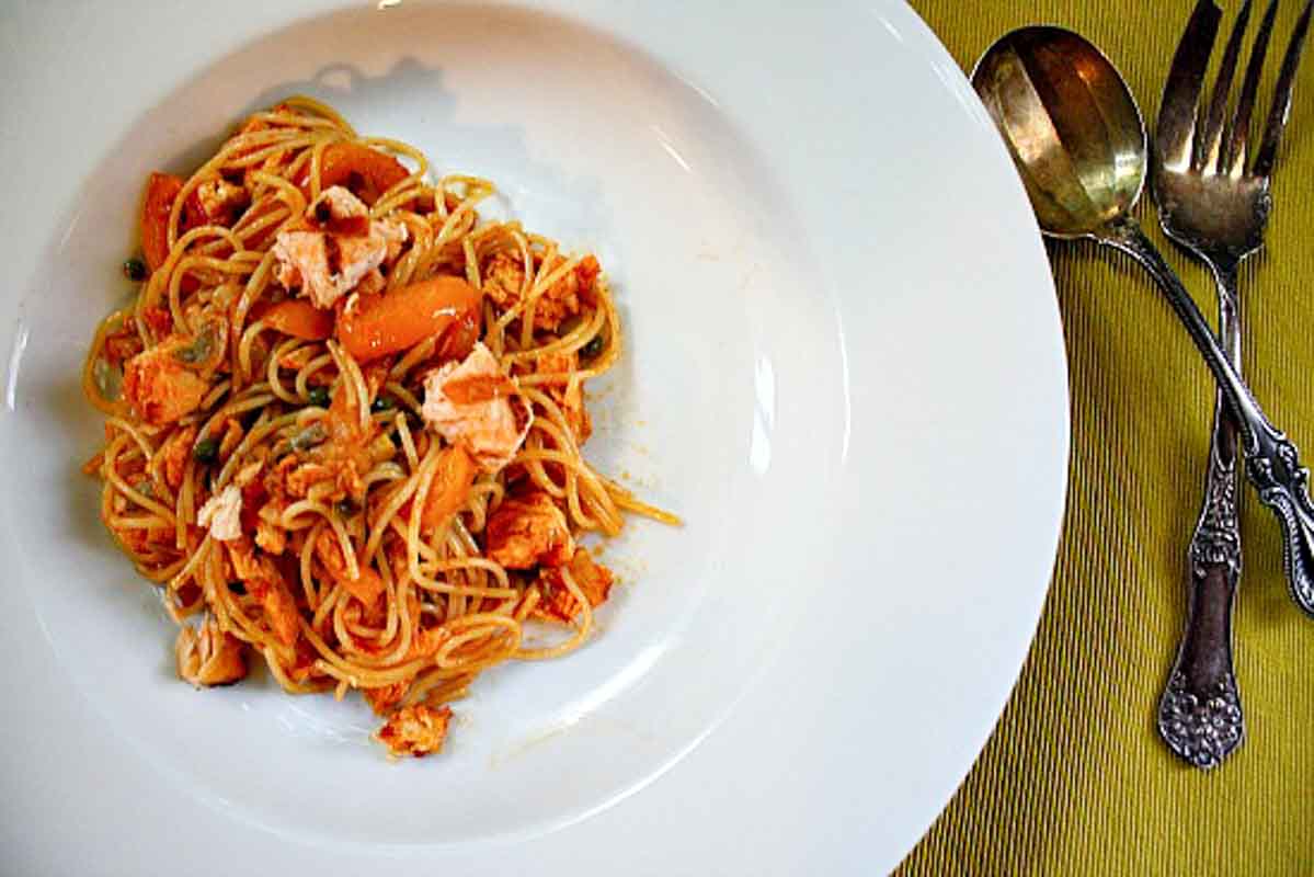 Angel hair pasta with salmon and vegetables.