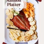 Smoked salmon platter with cheese and crackers.