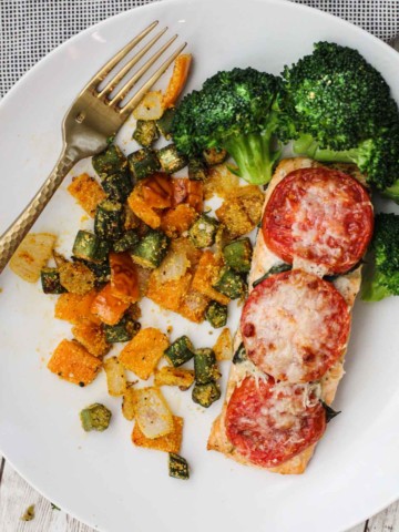 Salmon fillets topped with fresh tomatoes and parmesan served with toasted okra and steamed broccoli