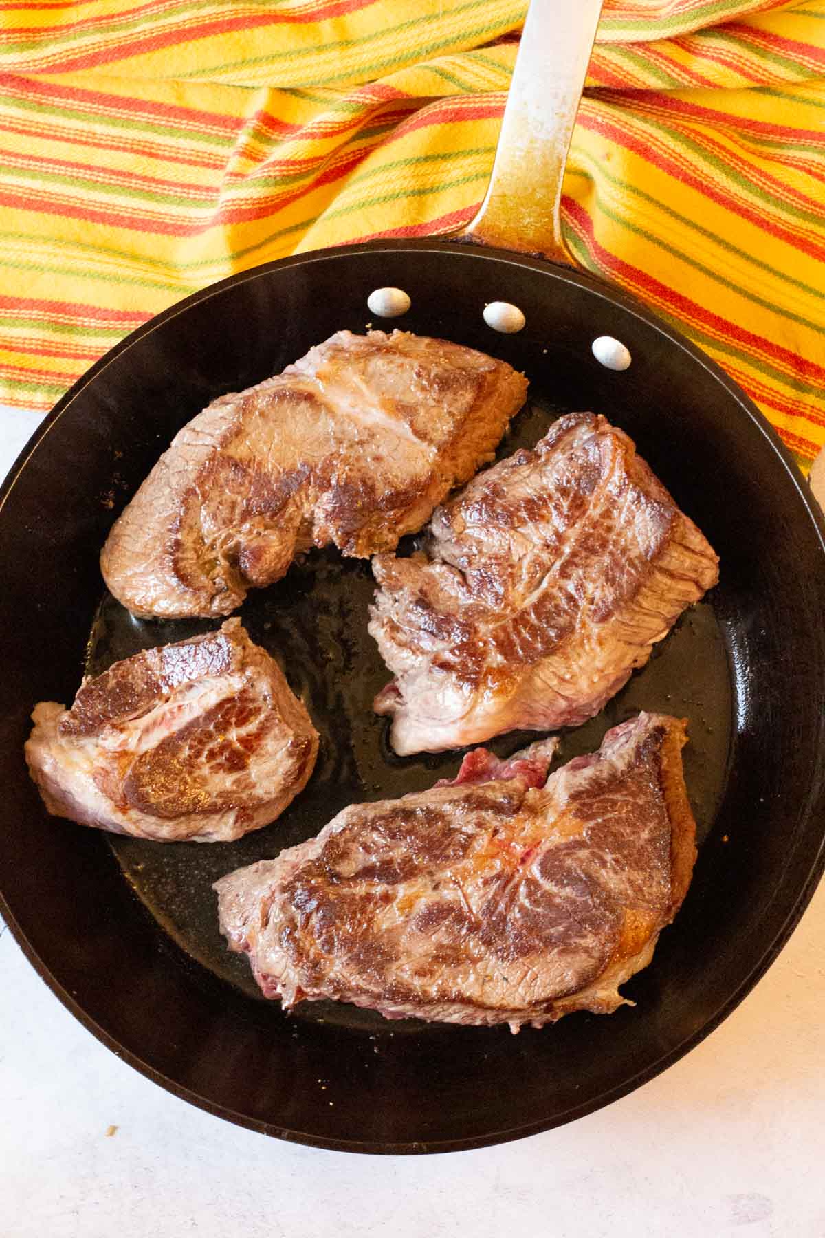 Browning chuck roast for slow cooker beef barbacoa.