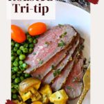 oven baked tri-tip roast served with peas and potatoes