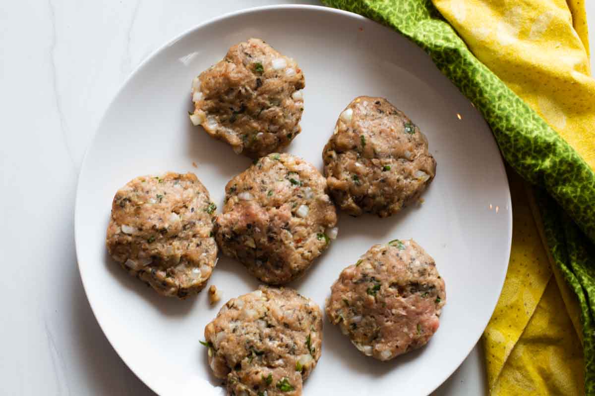 Homemade turkey sausage patties ready to cook.