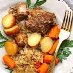 Slow Cooker Country Style Ribs with sauerkraut, potatoes and carrots.