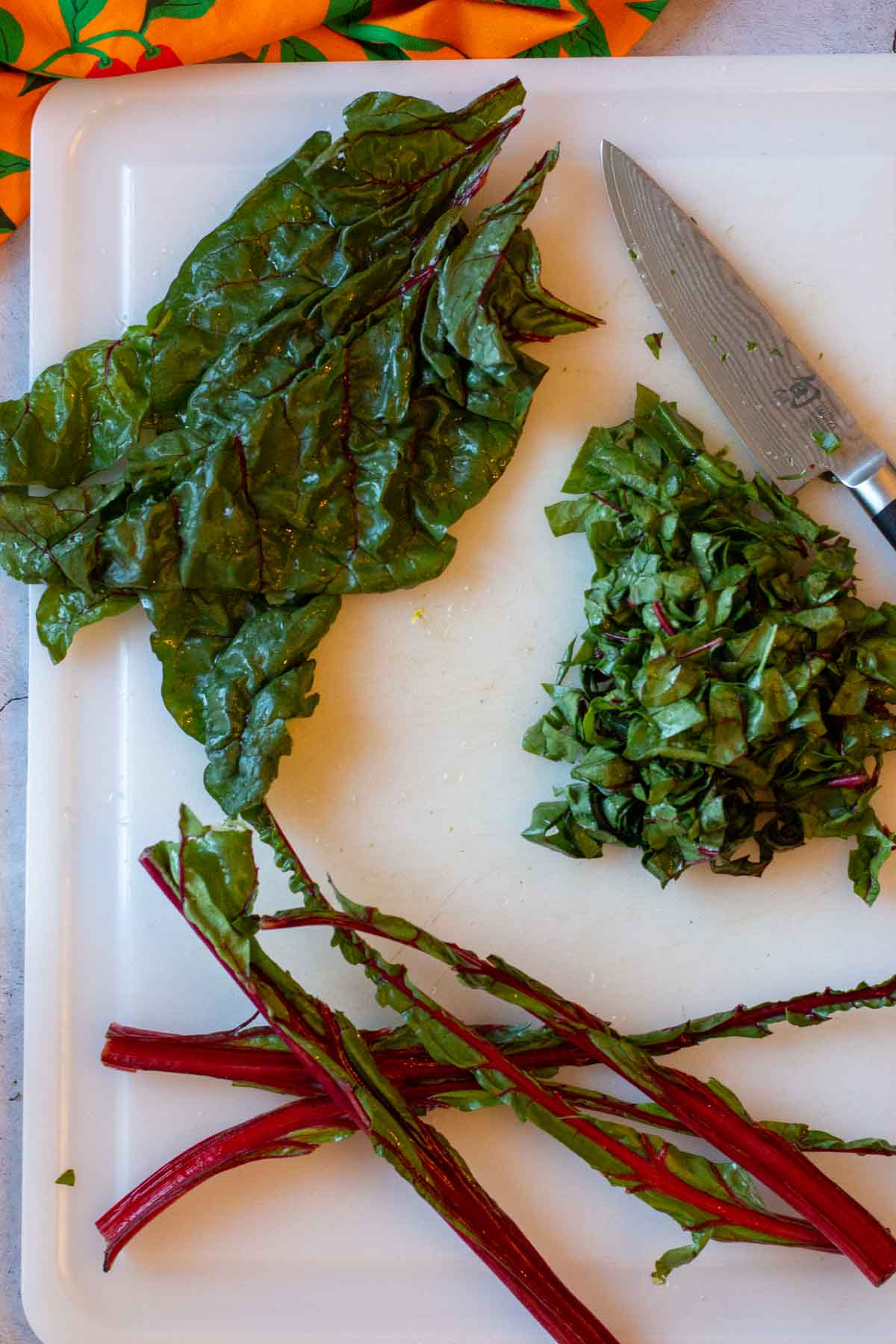 Removing leaves from Swiss Chard.