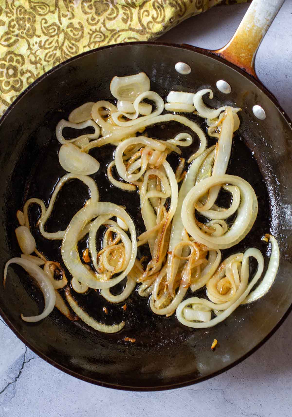 Sauteeing onions in a heavy skillet.