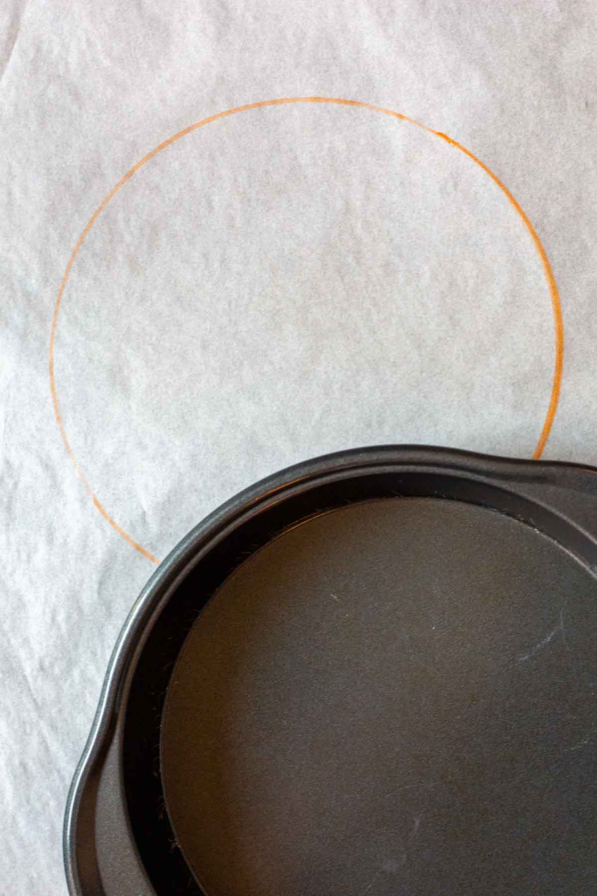 How to mark parchment paper to cut and fit in a cake pan.