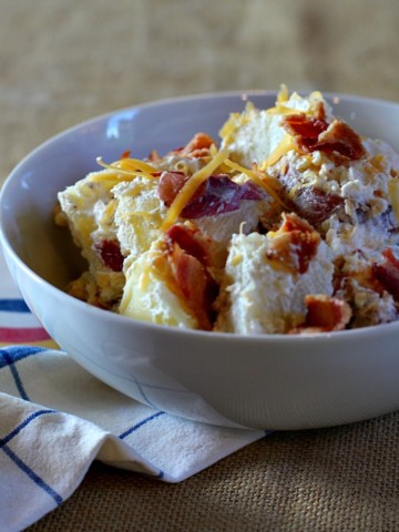 Perfect potato salad for a picnic. Loaded Potato Salad with bacon and cheese.