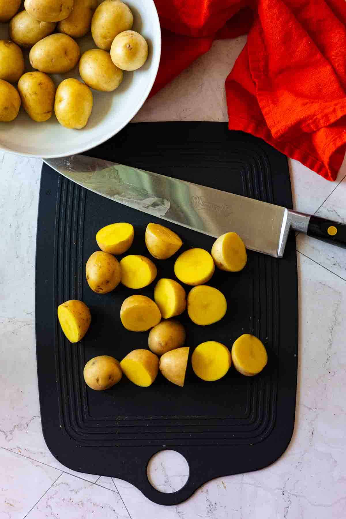 Step 1: Slicing potatoes to make Potato salad with bacon.