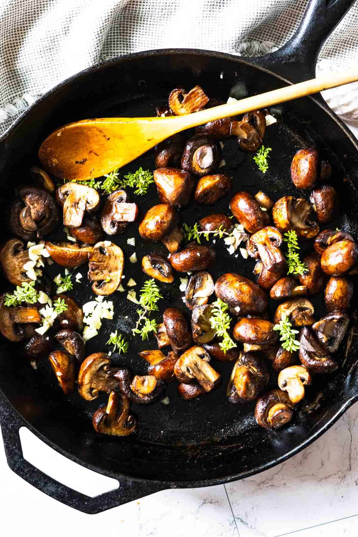 Browning mushrooms to make mushroom cream sauce for bavette steak.
