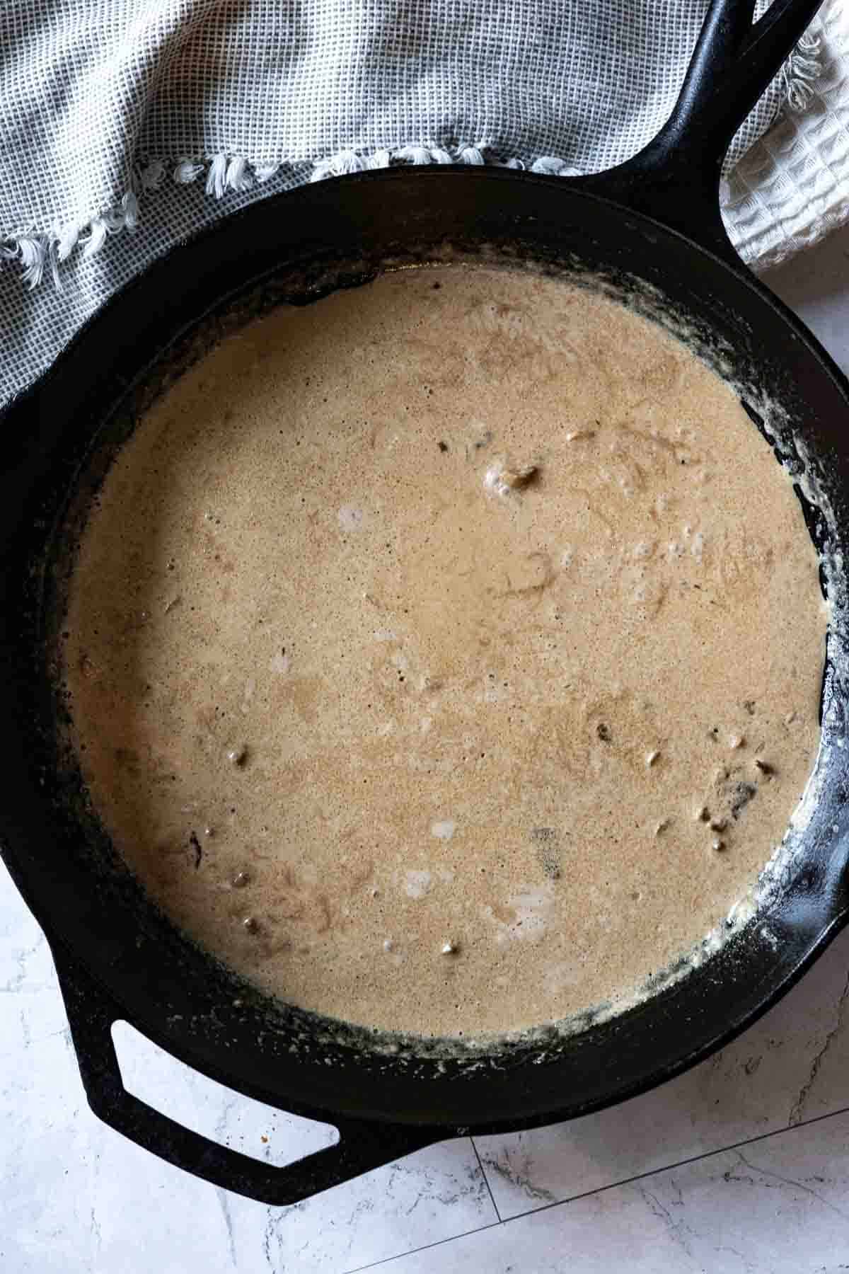Making cognac cream sauce for bavette steak.