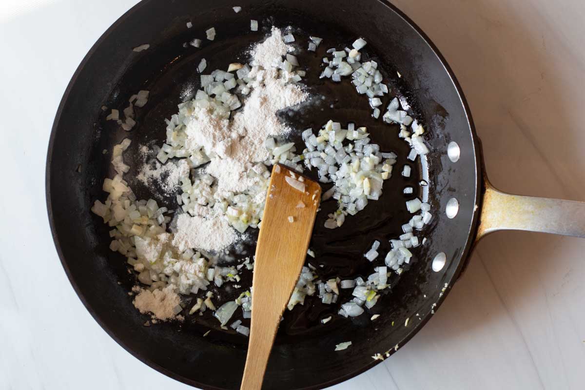 Adding flour to make green chile sauce