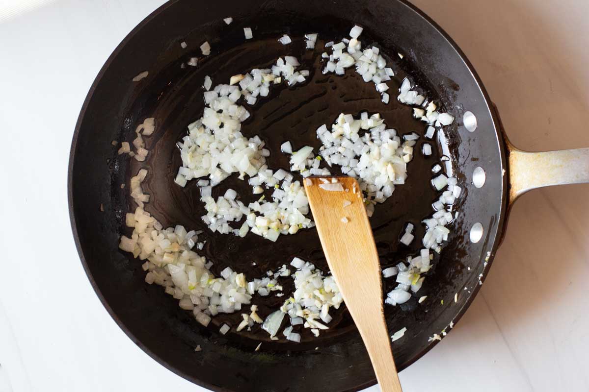cooking onions to make hatch green chile sauce