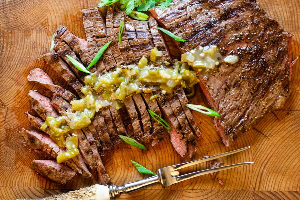 Grilled flank steak with green chile sauce