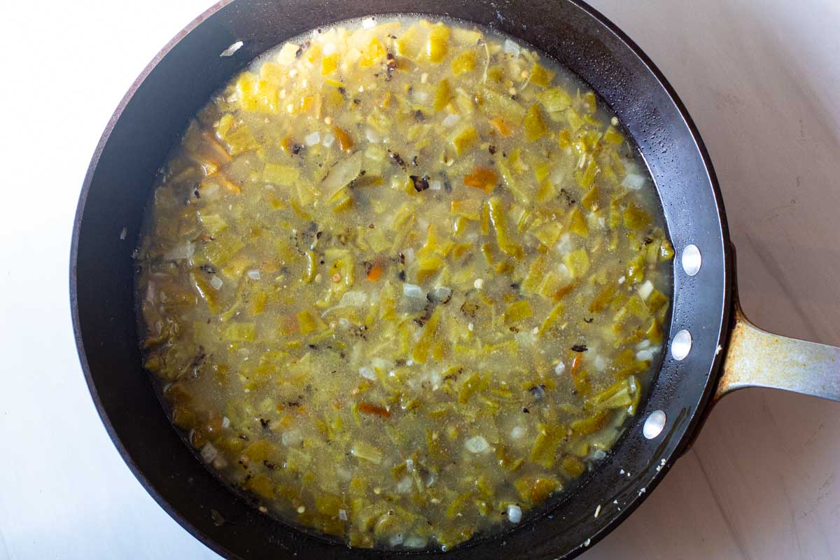 Cooking hatch green chile sauce in a fry pan