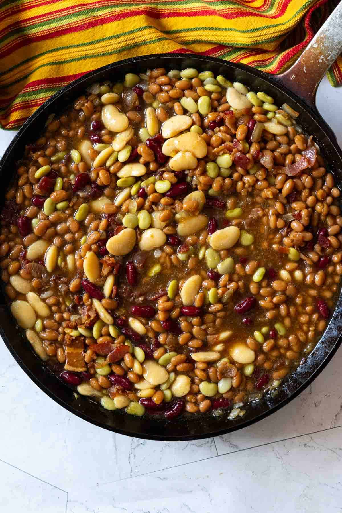 Add all beans to a skillet to make calico beans.