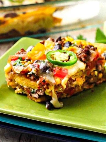 A slice of Layered Mexican Casserole with ground beef and corn tortillas.