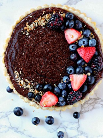 Chocolate tart topped with strawberries and blueberries