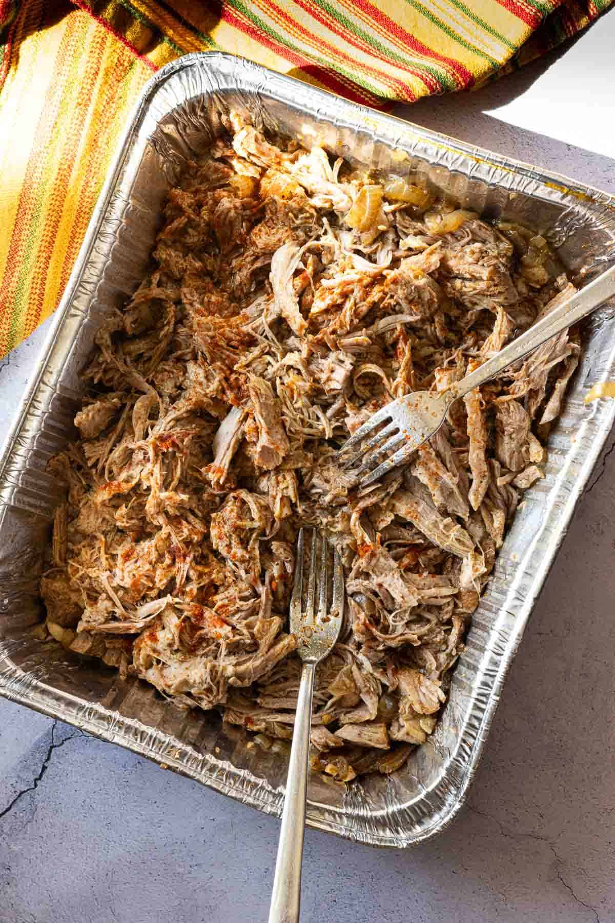 Shredding pork roast to make pulled pork sliders.