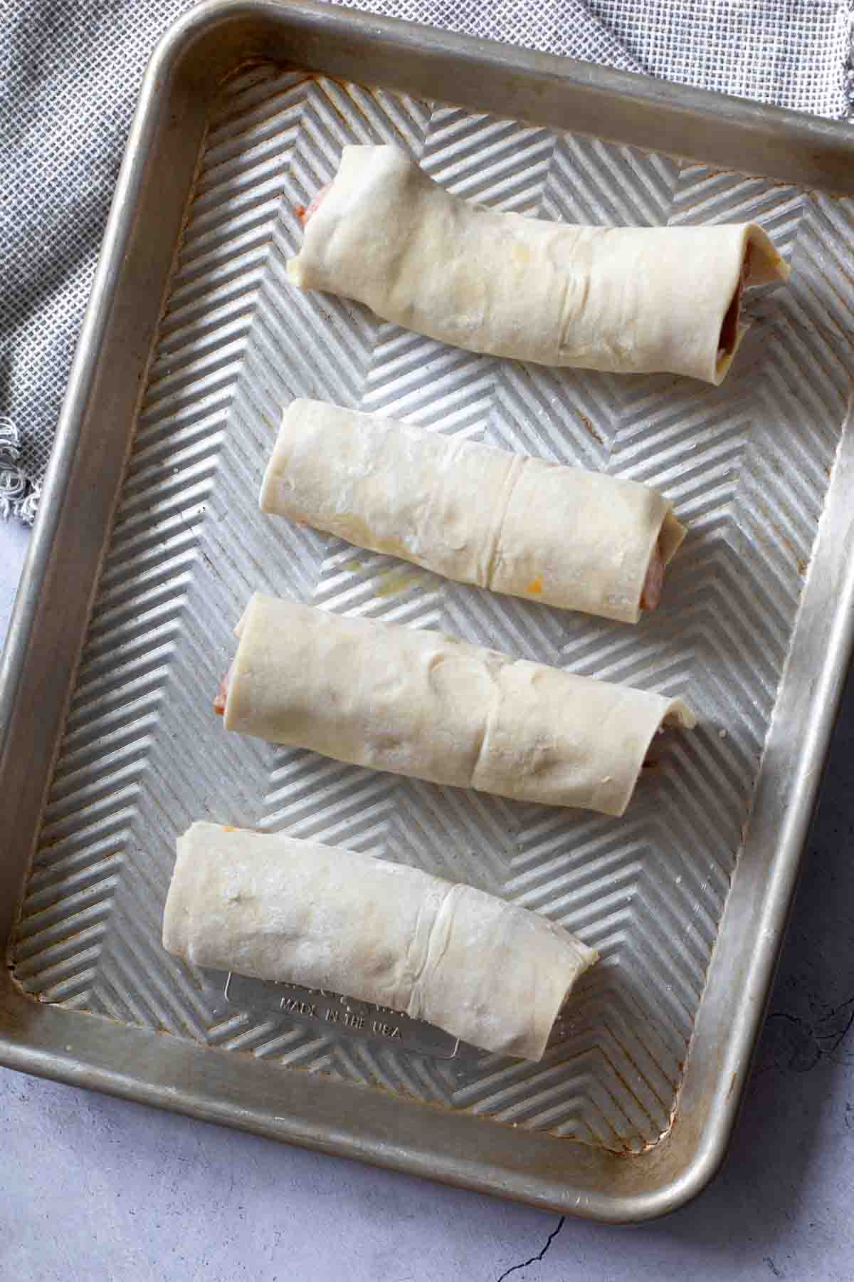 Sausage links wrapped in puff pastry dough.