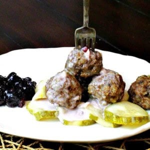 Authentic Swedish Meatballs served with pickles and lingonberries.