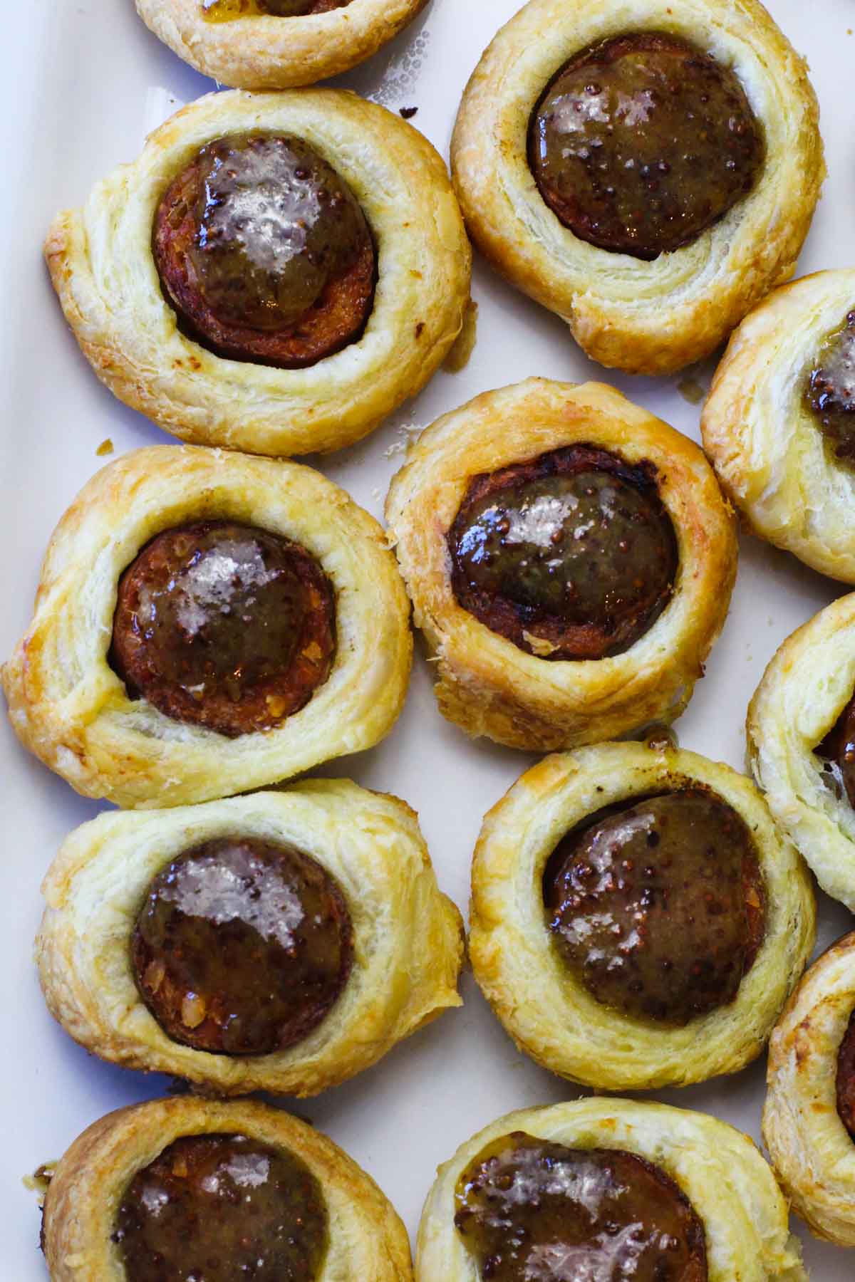 Puff pastry pigs in a blanket with andouille sausage.