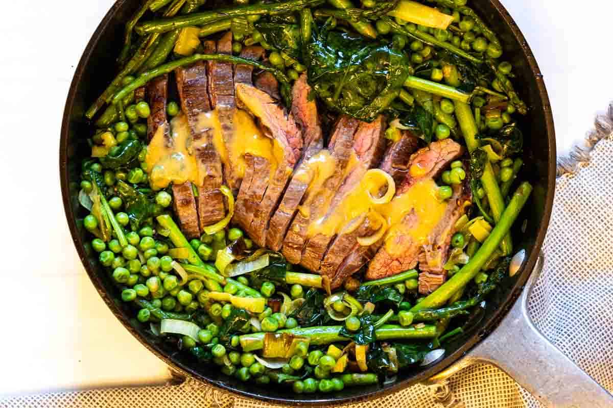 One skillet steak and mixed vegetables.