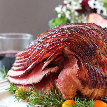 Spiral Cut Honey Glazed Ham on a white platter.