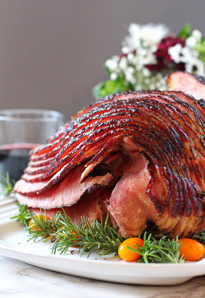 Spiral Cut Honey Glazed Ham on a white platter.