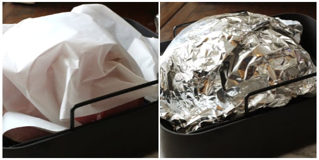 How to reheat a spiral ham in a roaster using parchment paper and aluminum foil