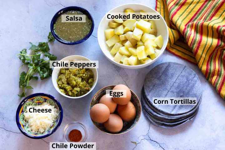 Ingredients to make egg and potato breakfast tacos.
