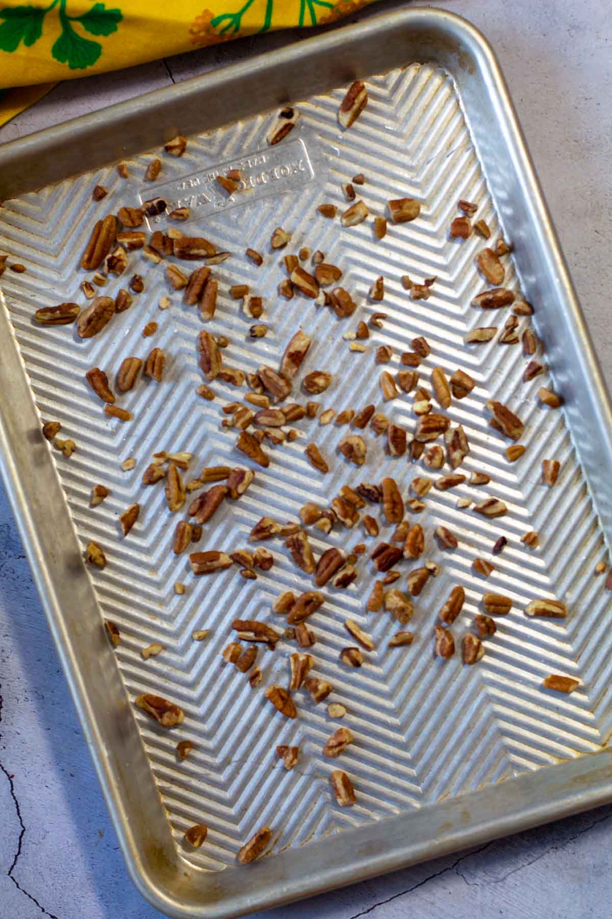 Toasting almonds on a sheet pan.