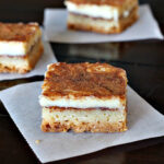 Churros Cheesecake Bars, a wonderful creamy cinnamon treat on a shortbread crust. A great dessert recipe for a Mexican meal.