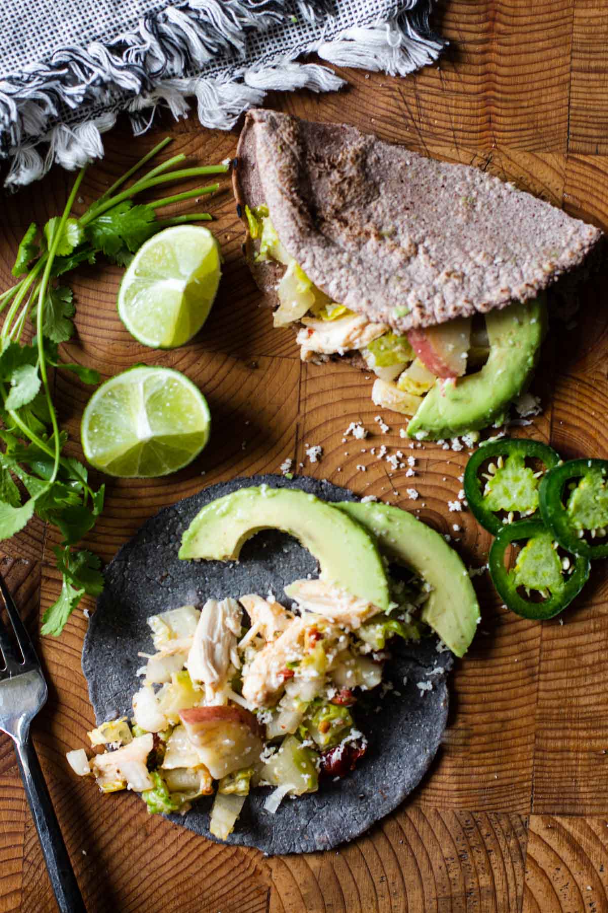 Rotisserie chicken tacos with potatoes, avocado and romaine.
