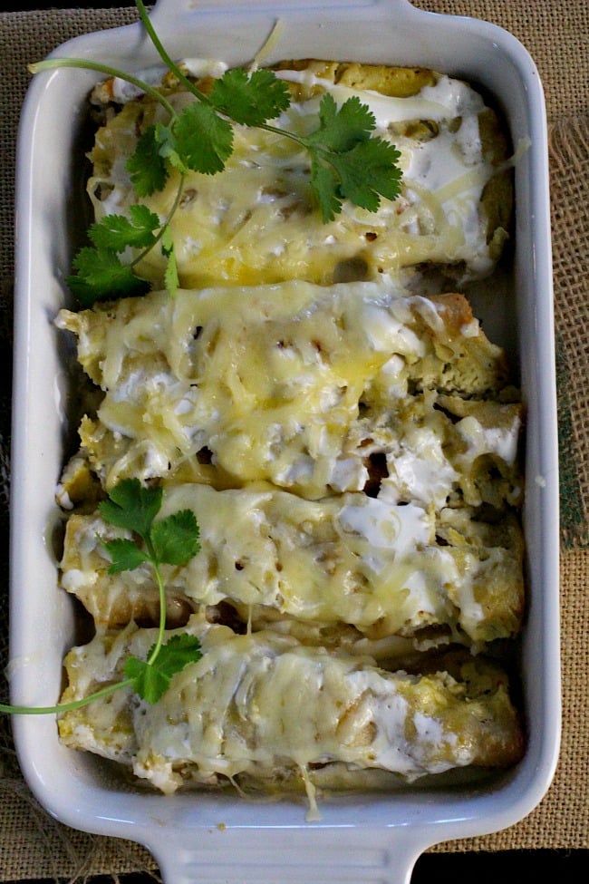 Beer braised slow cooker pulled pork enchiladas. Made in the crockpot or slow cooker and you've got a great Mexican Casserole Recipe.