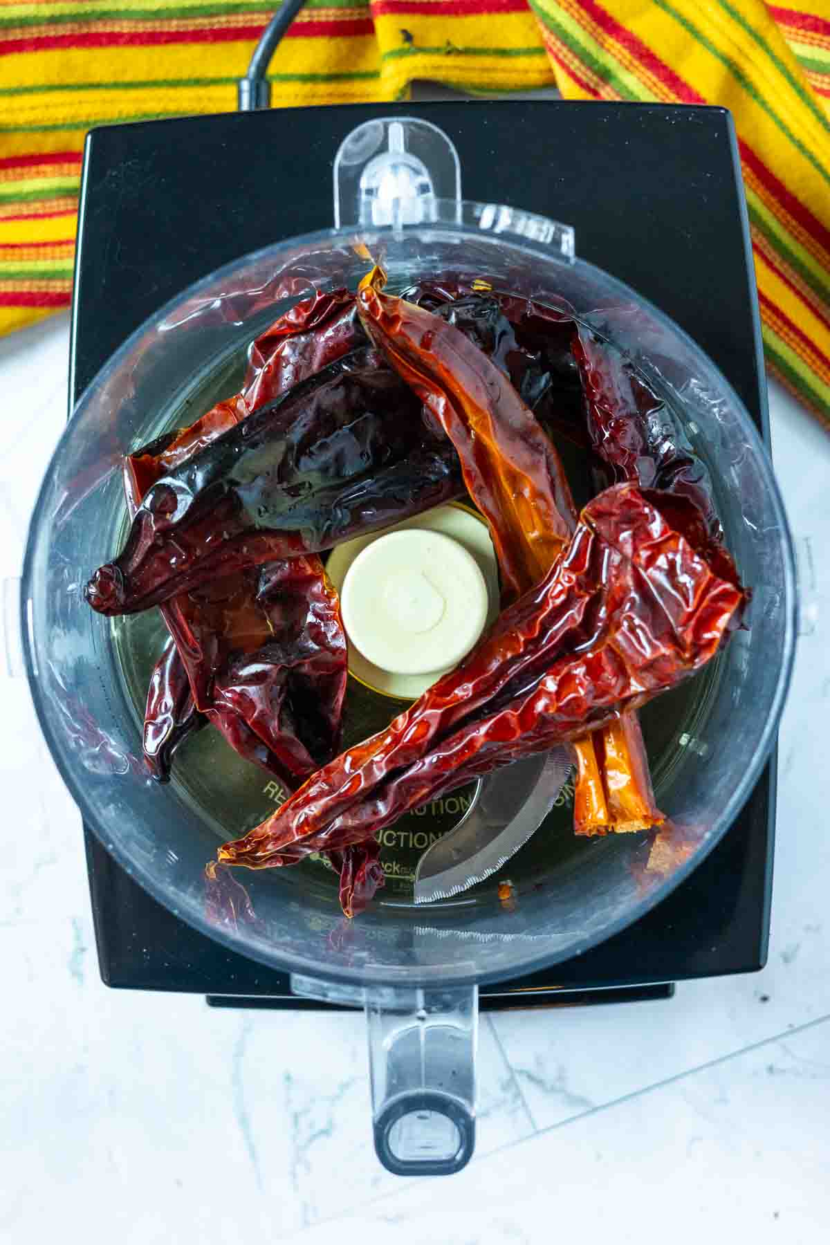 Chile peppers in a food processor to make sauce for Mexican Pot Roast, Step 6.